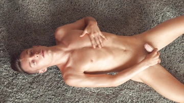 Nude guy masturbating and cums