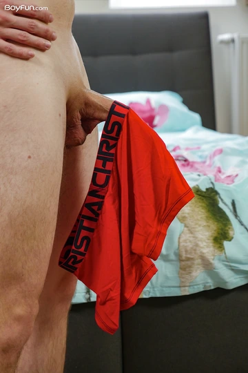 Boy with a long smooth shaved cock