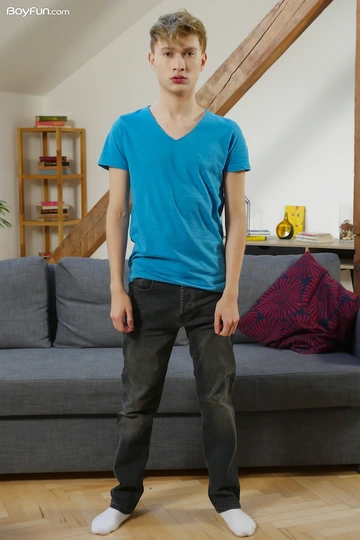 Cute blonde boy getting naked