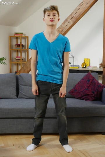 Cute blonde boy getting naked
