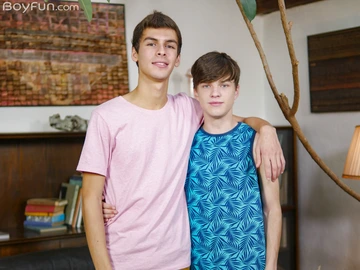 Boys on a black sofa having sex