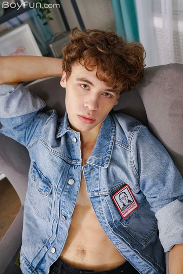 Curly boy with a fit body